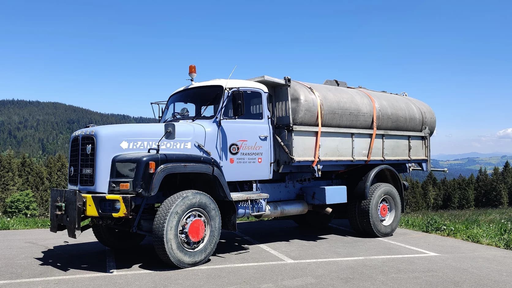 A septic pump truck parked on site, ready to service a tank.